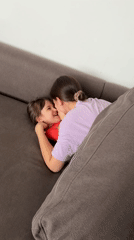 Mother and child share playful morning moments in Krasnoyarsk home