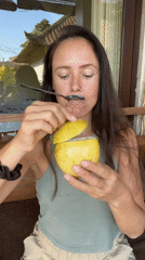 Woman enjoys tropical fruit sampling session in Ubud, Indonesia