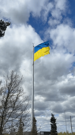 Ukrainian flag flies in Vorzel amid cloudy skies