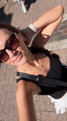 Woman records selfies near bronze sculpture in Stade