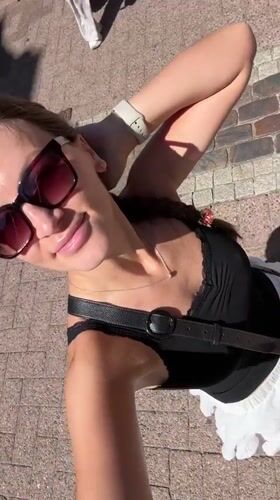 Woman records selfies near bronze sculpture in Stade