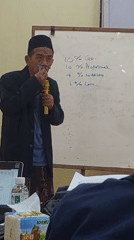 Formal community gathering with speakers in Langkap, Indonesia