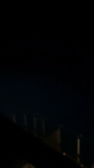 Nighttime water reflections captured from Mediterranean coastal vantage point