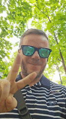 Man gestures for camera in Moscow park