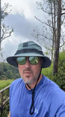 Man in blue shirt observed on hill in Kintamani