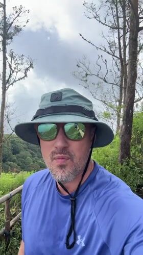Man in blue shirt observed on hill in Kintamani