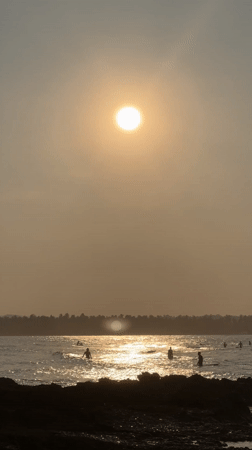 Morning beach activities documented in General Luna, Philippines