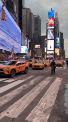 Evening crowds gather in bustling Times Square