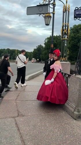 Period costumes and motorcycles near Saint Petersburg's historic landmarks