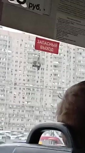 Smoke seen from apartment building window in Balashikha, Russia