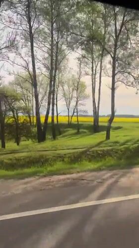 Vehicle travels rural road near Minsk, Belarus early morning