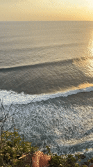 Clifftop lighthouse documented during sunset in Kuta Selatan