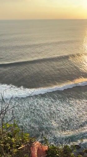 Clifftop lighthouse documented during sunset in Kuta Selatan