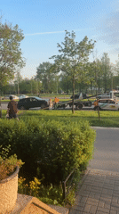 SUV towed from roadside verge, three people present