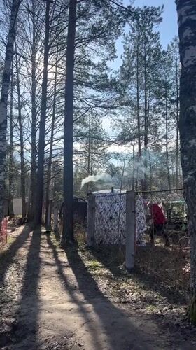 Early morning camping routine documented in Russian forest