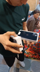 Man unboxes new iPhone in Nizhnevartovsk, Russia