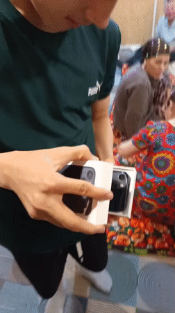 Man unboxes new iPhone in Nizhnevartovsk, Russia
