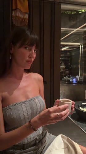 Diners document steak preparation at Indonesian restaurants
