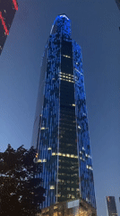Modern skyscrapers and public sculpture in a dense city center