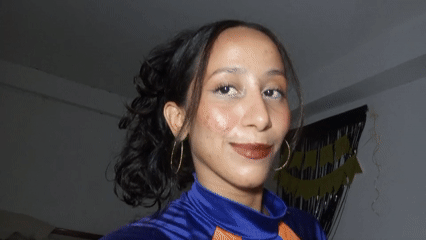 Woman poses for video in blue outfit in Porlamar