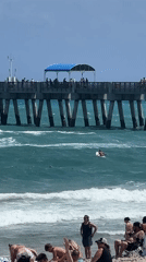 Evening beach activity documented at Lake Worth Beach pier