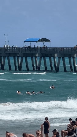 Evening beach activity documented at Lake Worth Beach pier
