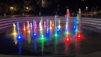 Nitra's illuminated plaza fountain cycles through colors at night