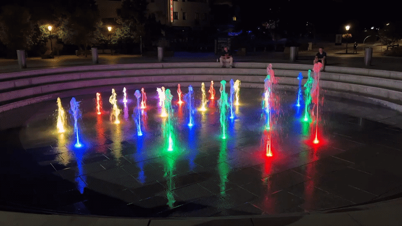 Nitra's illuminated plaza fountain cycles through colors at night