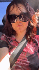 Passenger spotted in vehicle wearing floral top in Izhevsk