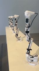 White robotic arms displayed on table in Tel Aviv