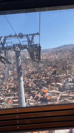 Cable car passenger films La Paz cityscape views