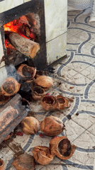Traditional food preparation and river commerce documented in Vietnam