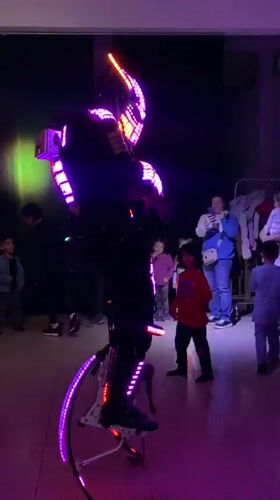 Robot performer on stilts entertains children's party in Argentina