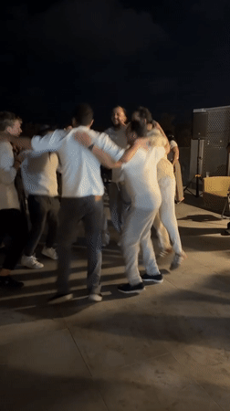 Circle dancing at a nighttime celebration in Tel Aviv