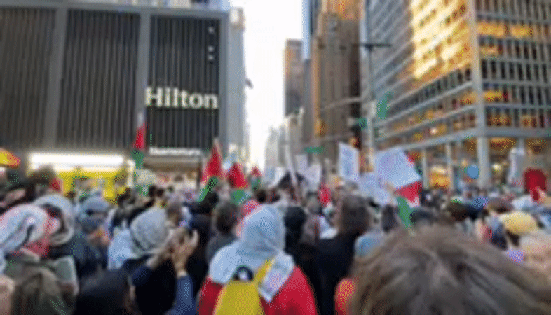 NYC protesters demonstrate against Mayor Mundani with Palestinian flags