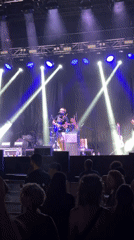 Live band rocks Sant Just Desvern under blue and purple lights