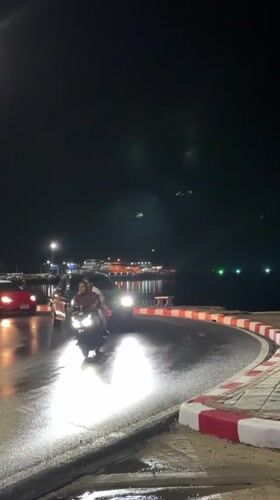 Nighttime scenes captured in Nathon, Thailand during rainy conditions