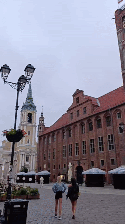 Toruń's Gothic Old Town square and castle on a summer evening