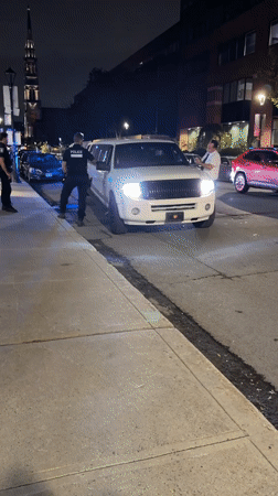 Montreal Police Conduct Nighttime Traffic Stop Involving White Limousine