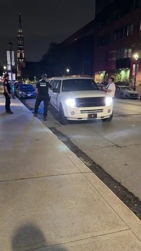 Montreal Police Conduct Nighttime Traffic Stop Involving White Limousine