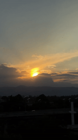 Sunset captured over Mexico City with mountains and urban landscape