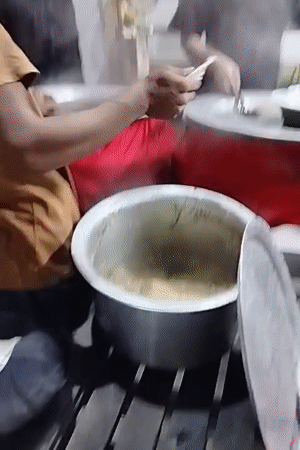 Inside and outside a Dhaka biryani restaurant during prep