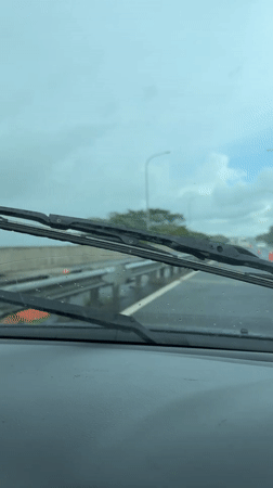 Wet highway conditions observed in Bandaragama during overcast weather
