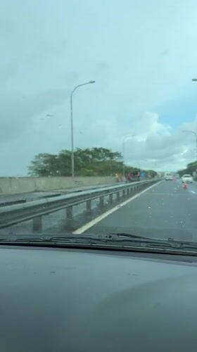 Wet highway conditions observed in Bandaragama during overcast weather