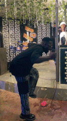 Live stage performance at an indoor event in Guzape