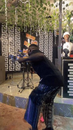 Live stage performance at an indoor event in Guzape