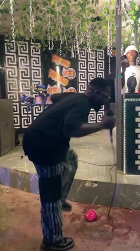 Live stage performance at an indoor event in Guzape