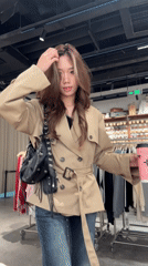 Women take selfies in clothing store in China