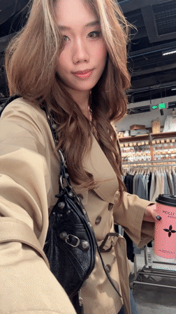 Women take selfies in clothing store in China