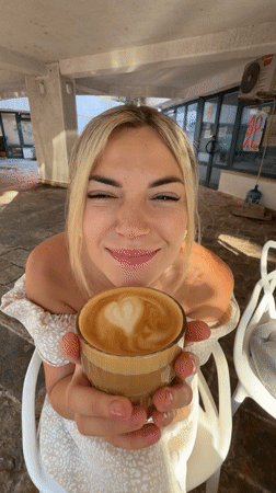 Morning coffee and a street cat in Budva, Montenegro